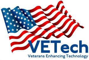 VETechlogo-300x203 A stylized American flag waves above the blue text VETech with the subtitle Veterans Enhancing Technology below it on a white background.